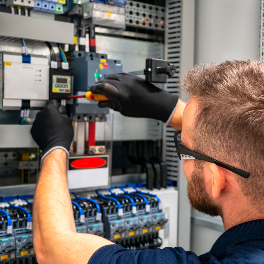 electrician working on panel