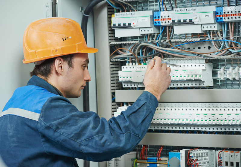 electrician working on panel